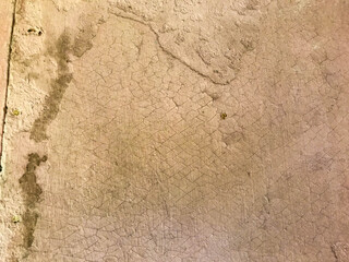 texture. cracked pink paint. the paint cracks with a mesh. on the paint stains of dirt, debris, yellowed spots. holes in the paint, cuts. homemade texture, background