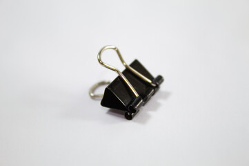 Black paper clip with white background