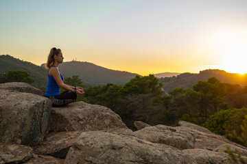 Naklejka na ściany i meble meditating girl on the mountain