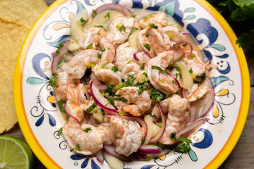 Mexican shrimp raw aguachile on wooden background