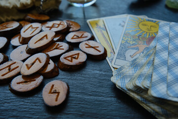 wooden runes from the Tarot card on the table