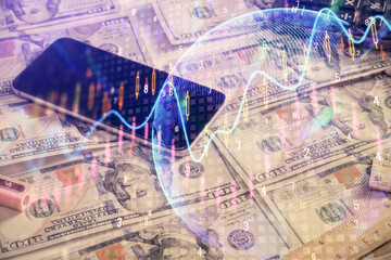 Double exposure of forex graph drawing over us dollars bill background. Concept of financial markets.