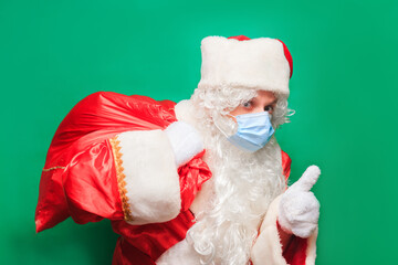 Coronavirus. Convid-19. Santa Claus wears a face mask to prevent CORONAVIRUS.