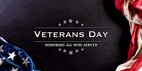 Fototapeta na wymiar Happy Veterans Day concept. American flags against blackboard background. November 11. Day.