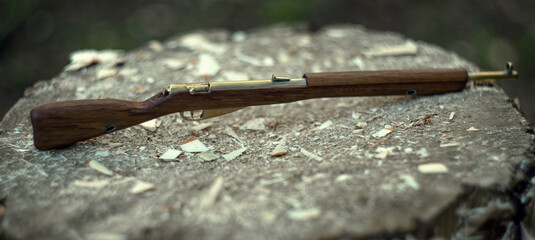 Miniature rifle made of wood and brass
