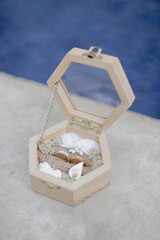 wedding ring on a wooden box
