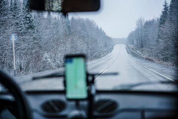 view from retro, vintage car inside with part of interior gps screen with driver male hand on the...