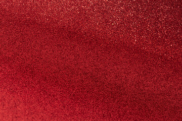 Red glitter texture abstract background. Shiny glowing colors.