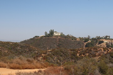Fototapeta na wymiar lone house on top of hill