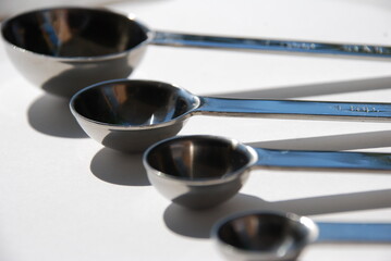 measuring spoons with shadow