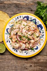 Mexican shrimp raw aguachile on wooden background
