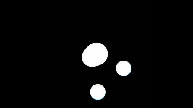 4k Infinite loop animation loading with white orbital circles and black background