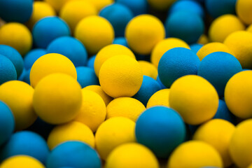 Set of yellow and blue plastic balls