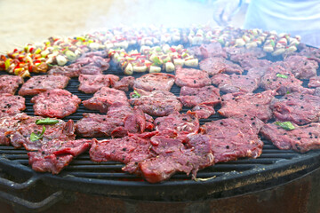Grilling shashlik on barbecue grill. Selective focus