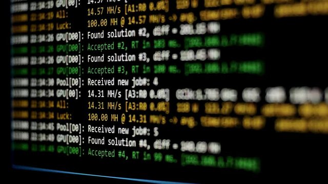 Mining Cryptocurrency process program on display PC. Display screen with real cryptocurrency miner. Cryptocurrency mining on a computer screen. Share Found. Selective focus.