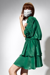  Fashion female coronavirus, model posing with gloves and protective medical mask