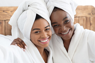 Pretty african women having ladies day at home