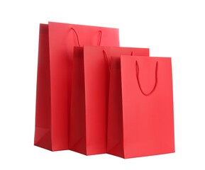 Red paper shopping bags isolated on white