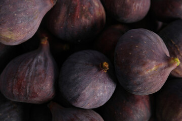 Tasty raw purple figs as background, closeup