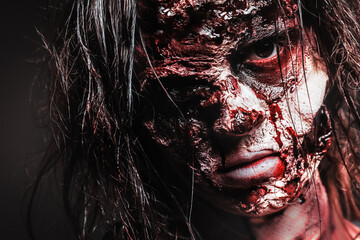 Scary zombie on dark background, closeup. Halloween monster © New Africa