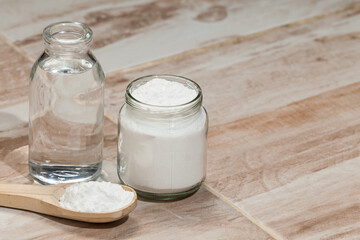 Baking soda - sodium bicarbonate and vinegar, photo on the house floor.