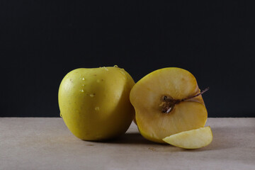 Fresh yellow apple split in half