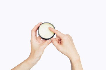women hands hold wax product in for hair styling before going to work isolated