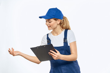 Working woman in uniform documents delivery service courier services