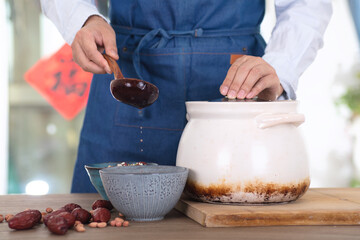 Chinese chef is preparing to scoop up the prepared Laba congee