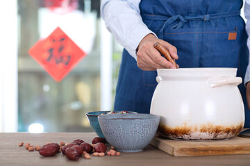 Chinese chef is preparing to scoop up the prepared Laba congee