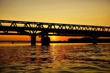 Fototapeta premium Bridge with sunset at Dordrecht. Zwijndrechtse bridge that connects South Holland with Brabant.