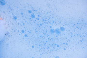 Abstract background white soapy foam texture. Shampoo foam with bubbles