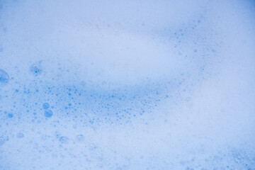 Abstract background white soapy foam texture. Shampoo foam with bubbles