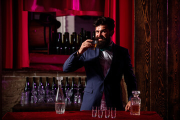 Bartender preparing cocktail. Macho drinking. Stylish rich man holding a glass of old whisky. Gentleman drink cognac or whiskey.