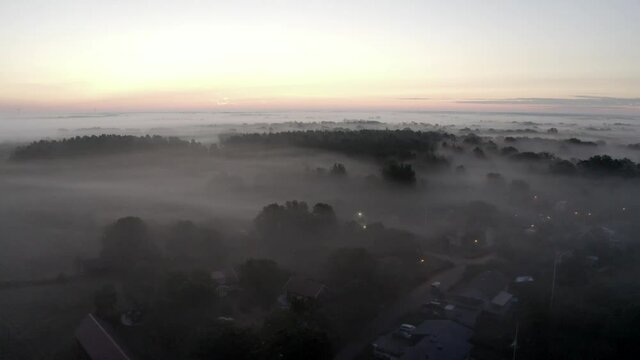Aerial shot of misty landscape in the countryside of Sweden.