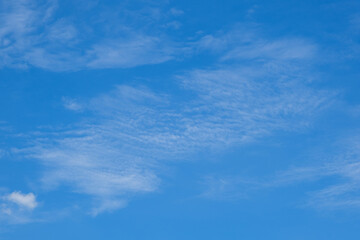 Blue sky with white clouds in daylight for background.