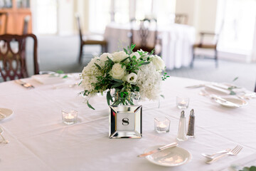 Close-up of a wedding reception table with salt and pepper and table number 8.  