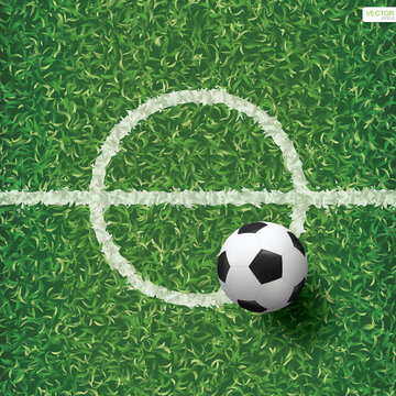 Soccer football ball on green grass of soccer field with center line area. Vector.