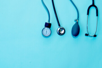 Cardiologi medical tools, Stethoscope and Sphygmomanometer on blue background