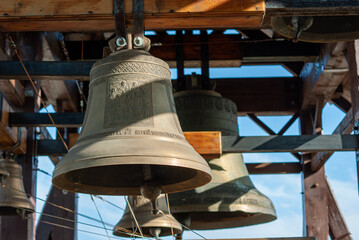 Fototapeta premium Church bells hanging in a wooden bell tower