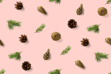 Fototapeta premium seamless christmas pattern from Pine cones on pink background. modern pine cone christmas collage. Print for paper, fabric, wallpaper pinecones