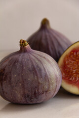 Fresh figs on a plate on a light concrete background
