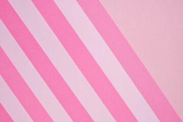 Pink striped paper background in pastel colors.Striped geometric background. paper abstract texture.wrapping paper.Color blocking background. pink  lollipop background