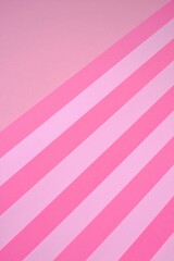 Pink striped paper background in pastel colors. geometric background. paper abstract texture.wrapping paper.Color blocking background.bright pink striped lollipop background