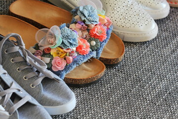 Variety of woman fashion shoes , sandal on gray background