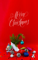 Obraz na płótnie Canvas Christmas card, banner, flatlay with text - Merry Christmas on a red background