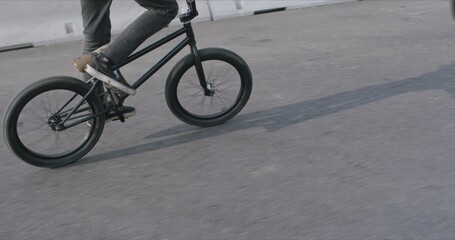 Extreme bmx cyclist doing bike tricks