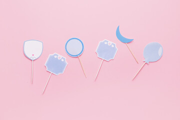 Stylish cupcake toppers on color background