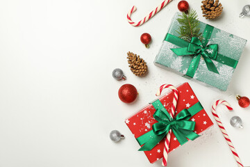 Gift boxes and Christmas accessories on white background
