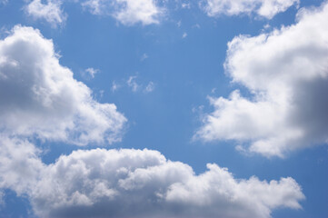 Fototapeta premium Light blue sky background with clouds.